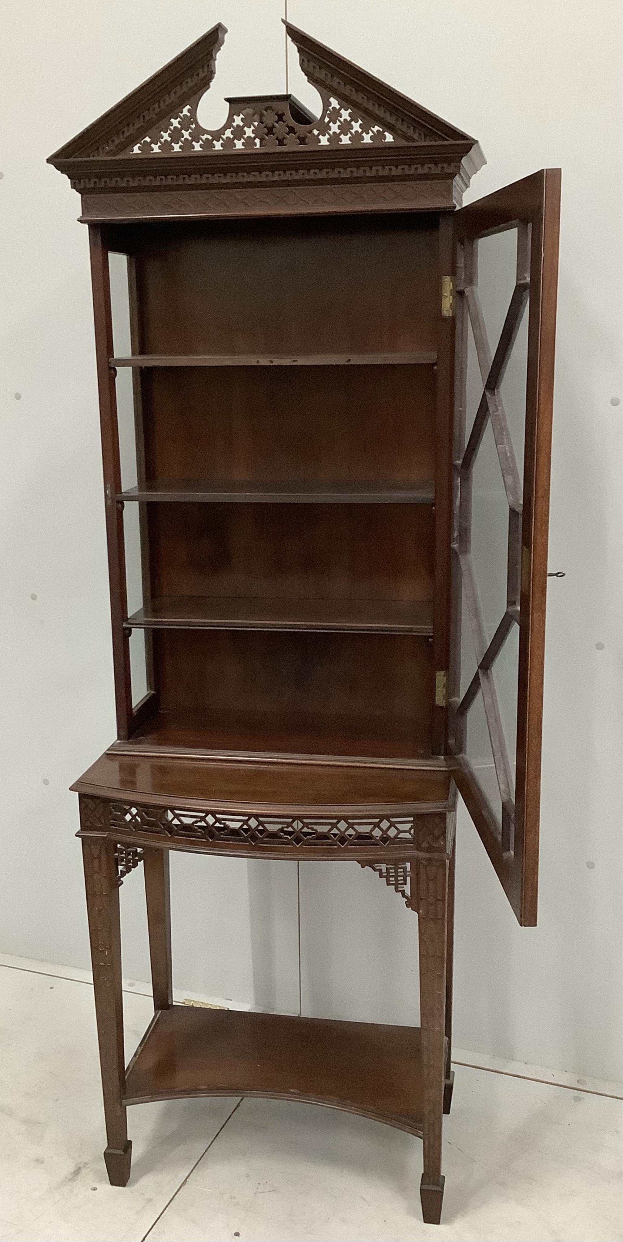 An Edwardian Chippendale Revival blind fret mahogany bow front display cabinet, width 62cm, depth 40cm, height 188cm